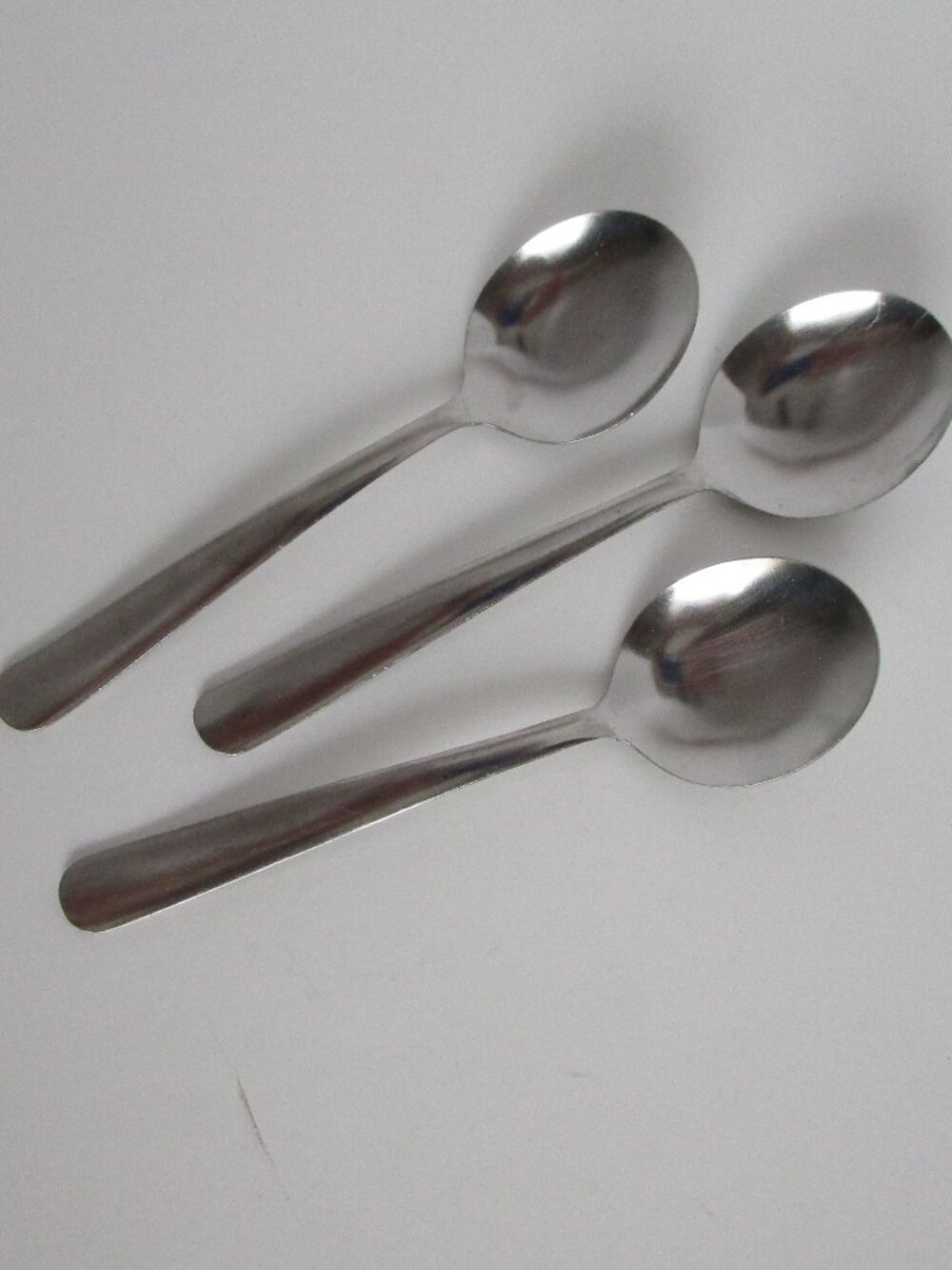 set of stainless steel soup spoons